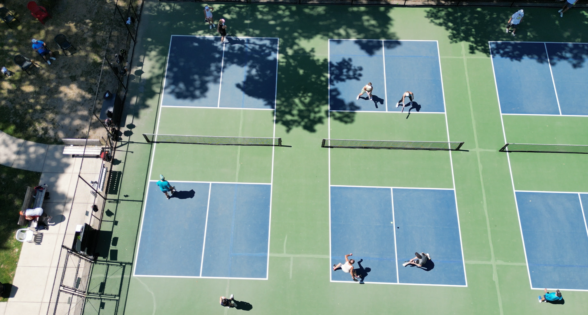 Aerial view of pickleball players on outdoor courts